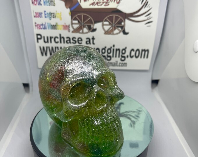 Clear skull with crystals and glow-in-the-dark rocks and lots of glitter throughout