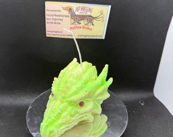 Dragonhead candle glow in the dark yellow, green and pink highlights citronella sent