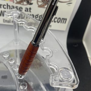 Four-way, pen, and pencil turn it to select to write in red and blue pen black pen  or pencil made from Red padauk gunmetal black metal