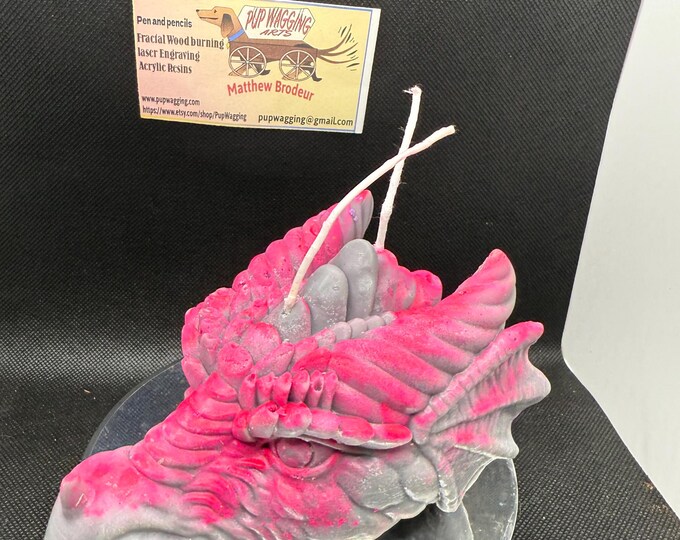 Dragonhead candle glow in the dark Gray and pink with a cologne sent
