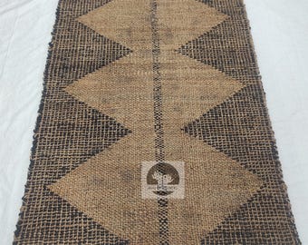 Alfombra Dhurrie de yute hecha a mano: tejido plano moderno, natural y negro