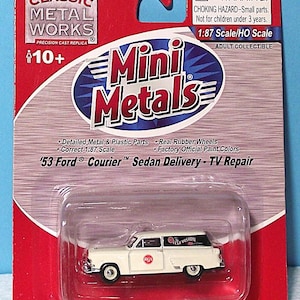May include: A white '53 Ford Courier Sedan Delivery - TV Repair model car in a clear plastic case. The packaging is red and features the "Mini Metals" logo and "Classic Metal Works" branding. The model is 1:87 scale.
