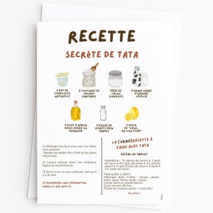 Peut inclure: Carte blanche avec une recette en français intitulée "RECETTE SECRÈTE DE TATA". La carte présente des illustrations à l'aquarelle d'ingrédients comme du yaourt, de la farine et du citron. Le texte comprend des instructions et une recette de gâteau au yaourt.