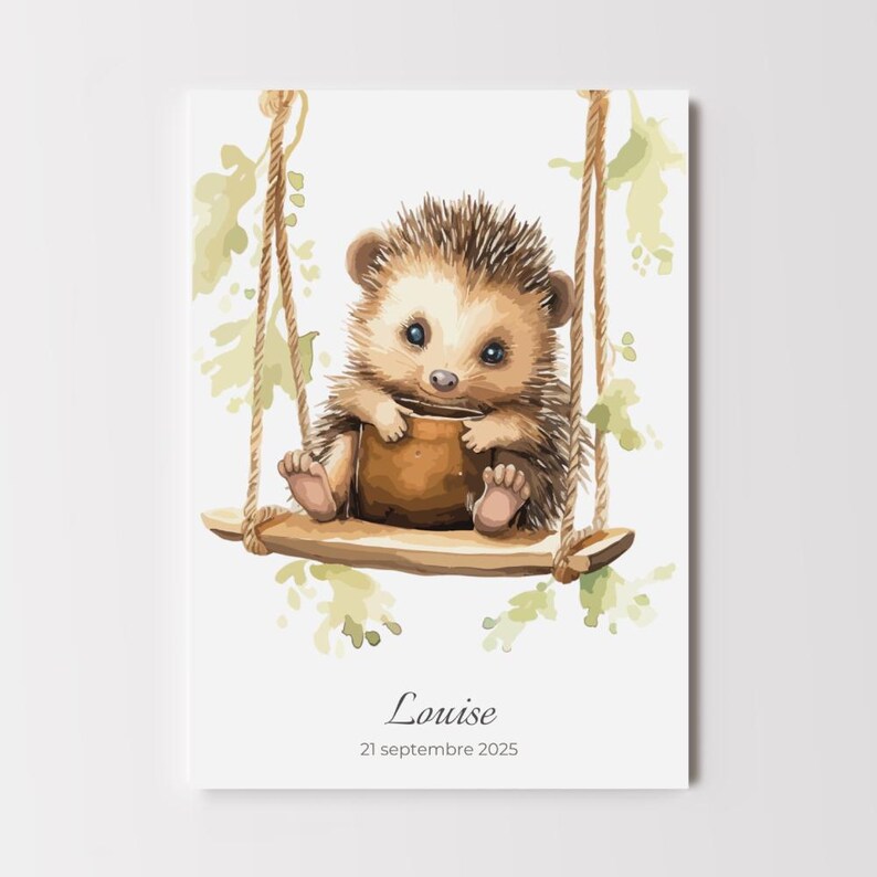 May include: A watercolor print of a baby hedgehog on a wooden swing. The hedgehog has brown and tan fur, blue eyes, and is holding a small brown pot. The swing is suspended by rope and surrounded by green leaves. The name "Louise" and the date "21 septembre 2025" are written below.
