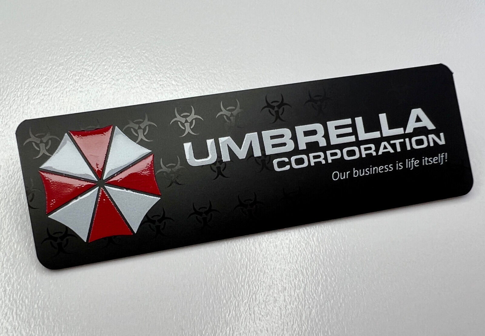 2pcs Rigid Plastic Sticker Tag Umbrella Corporation Resident Evil 3 4 5 6 Zombie