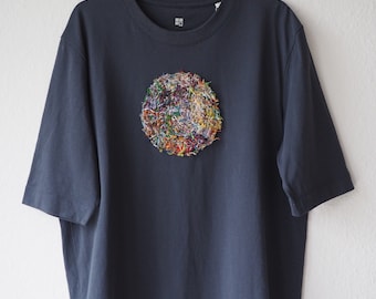 T-shirt with hand made patch made from rest of threads