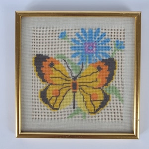 Butterfly embroidery in golden frame, wall decoration