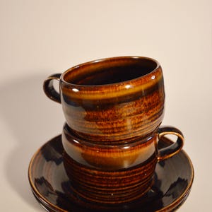 Brown Arabia cup and saucer, set of 2
