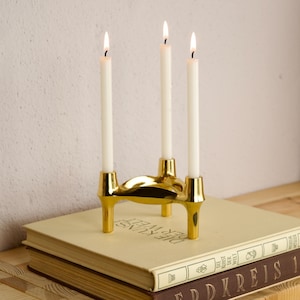 May include: A rustic wooden sign with the text "Welcome to our home" in white lettering. The sign features a distressed finish and a simple, inviting design, perfect for a front porch or entryway.