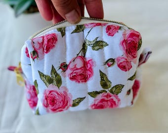 Mini pink patterned makeup bag - White background - Padded lining, zip closure - Storage for makeup, earphones, jewelry, pacifier
