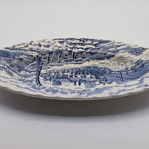 Vintage Staffordshire earthenware plate depicting a country setting.