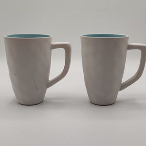 Set of 2 white porcelain cups with blue interior