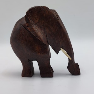 Vintage African hand carved wooden elephant sculpture.