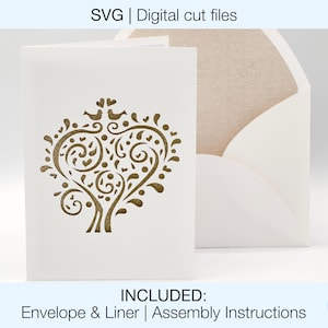 May include: A white greeting card with a gold-colored tree design and a matching envelope. The card features the text "SVG | Digital cut files" and "INCLUDED: Envelope & Liner | Assembly Instructions". The design is suitable for various occasions.