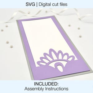 May include: A digital cut file for a card with a lavender border and a decorative floral design. The card has a white interior and a grey backing. The text "SVG | Digital cut files" and "INCLUDED: Assembly Instructions" are visible.
