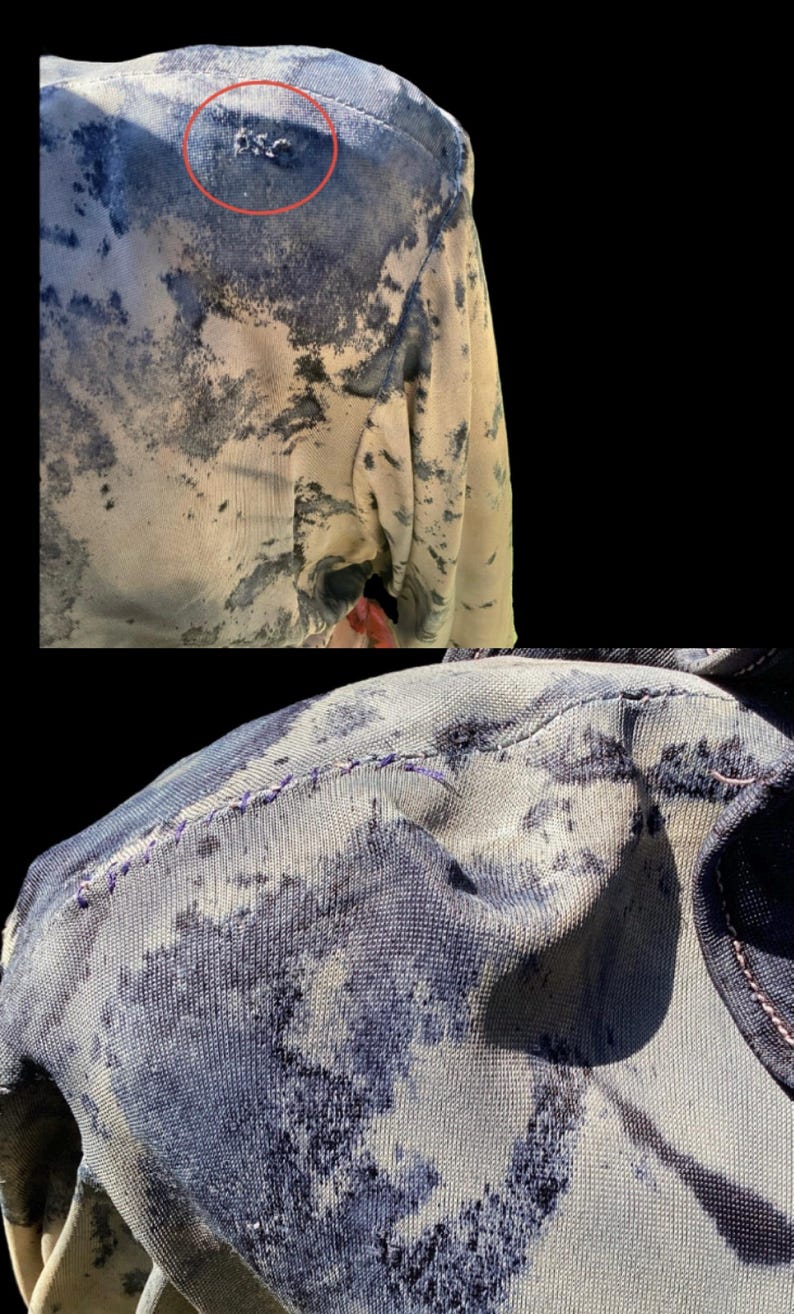 May include: Close-up of a garment with a unique pattern. The fabric features a blend of light beige and dark blue, creating a mottled effect. The stitching is visible, and the letters "BSC" are embroidered on the shoulder.