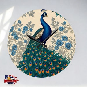 May include: A round clock with a peacock design. The peacock has blue and green feathers and is surrounded by a floral pattern in shades of blue and gray on a cream background.
