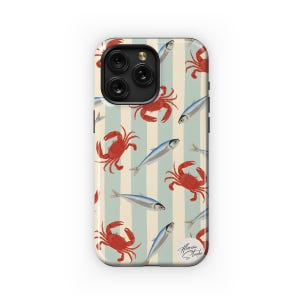 May include: A blue and white striped phone case with a pattern of red crabs and silver fish. The case has a cutout for the camera lens and a signature at the bottom.