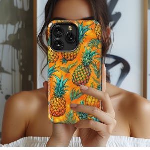 May include: A yellow and green phone case with a pineapple pattern. The case is made of a hard plastic material and has a matte finish.