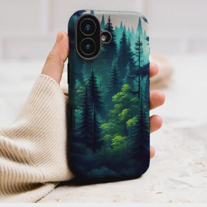 May include: A phone case featuring a forest scene with tall, dark green trees and lighter green foliage. The design has a painterly quality, with a gradient of colors from dark to light. The case has a dark blue border and a camera cutout.