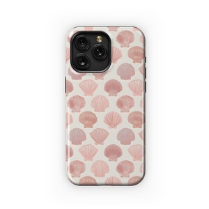 May include: A smartphone case featuring a repeating pattern of pink seashells on a cream background. The case has a glossy finish and a black border. The design is a light, summery aesthetic.