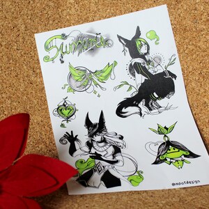 May include: A sheet of black and white illustrations with green accents. The illustrations include a wolf-like creature, a fairy, a heart, and a plant. The text "Sunfire" is at the top of the sheet. The text "@mootdesign" is at the bottom of the sheet.