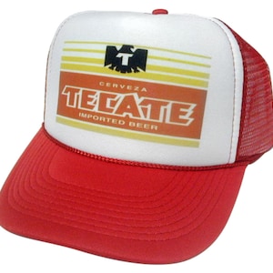 May include: Red and white trucker hat with a white front panel featuring a yellow and orange logo that says "Cerveza Tecate Imported Beer".