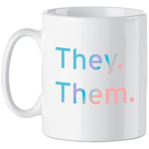 May include: White ceramic mug with the words "They. Them." printed in blue and pink gradient.