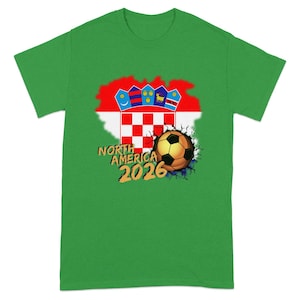 Green t-shirt with Croatia flag, soccer ball, and "NORTH AMERICA 2026" text.