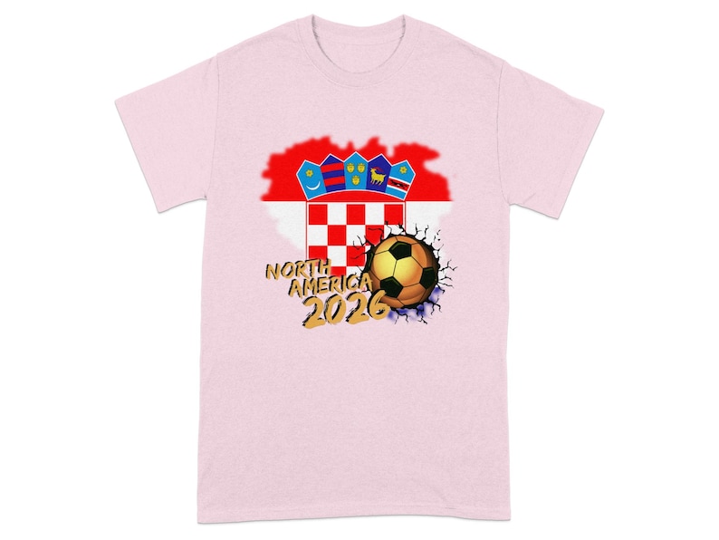 Pink t-shirt with cracked soccer ball and North America 2026 text.