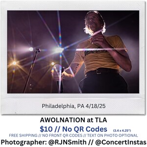 May include: A live concert photo featuring a performer on stage, holding a microphone. The performer wears a yellow t-shirt with text and dark pants. The stage is lit with bright lights. Text on the photo reads "AWOLNATION at TLA".
