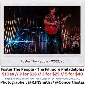 Puede incluir: Fotografía de un concierto con un músico tocando una guitarra eléctrica roja en el escenario. El escenario está iluminado con luces y láseres de colores. El texto "Foster The People" y "The Fillmore Philadelphia" son visibles.