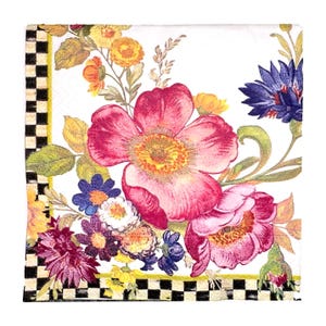 May include: A square white paper napkin with a floral design. The napkin features a large pink flower as the focal point, surrounded by other colorful flowers in shades of purple, blue, yellow, and orange. A black and white checkered border frames the design.