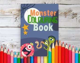 May include: A blue coloring book with the title "Monster Coloring Book" in colorful letters. The cover features a cartoon monster with a big mouth and three other monsters. The book is surrounded by colored pencils.