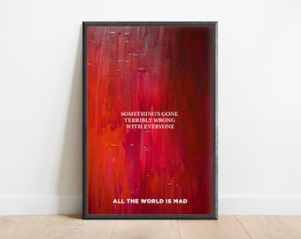 May include: A framed art print with a red abstract background and white text that reads "Something's gone terribly wrong with everyone. All the world is mad."