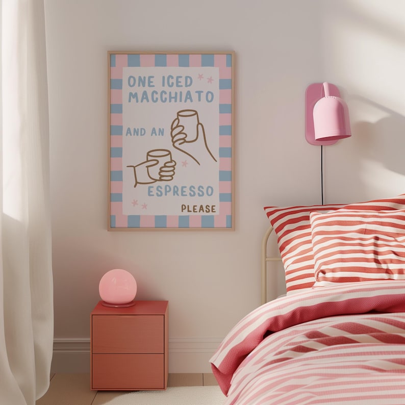 May include: A pink and blue striped poster with the text "ONE ICED MACCHIATO AND AN ESPRESSO PLEASE" and a cartoon illustration of two hands holding coffee cups.