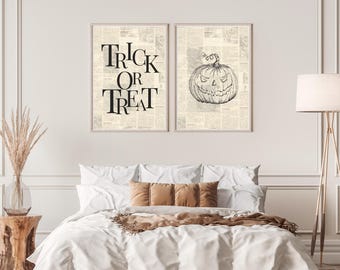 May include: Two framed Halloween-themed prints. One features the text "TRICK OR TREAT" in a bold, vintage font. The other print displays a detailed sketch of a carved jack-o'-lantern. Both prints are set against a newspaper background.