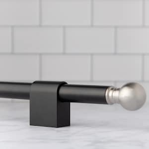 May include: A matte black curtain rod featuring a cylindrical shaft held by a rectangular black mounting bracket. The end of the rod is capped with a smooth, spherical finial finished in a brushed silver metallic tone.