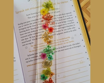 1. Epoxy bookmark with dried flowers in it