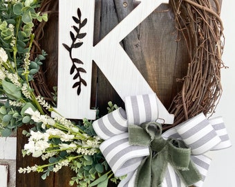 Floral custom initial door wreath - side bow