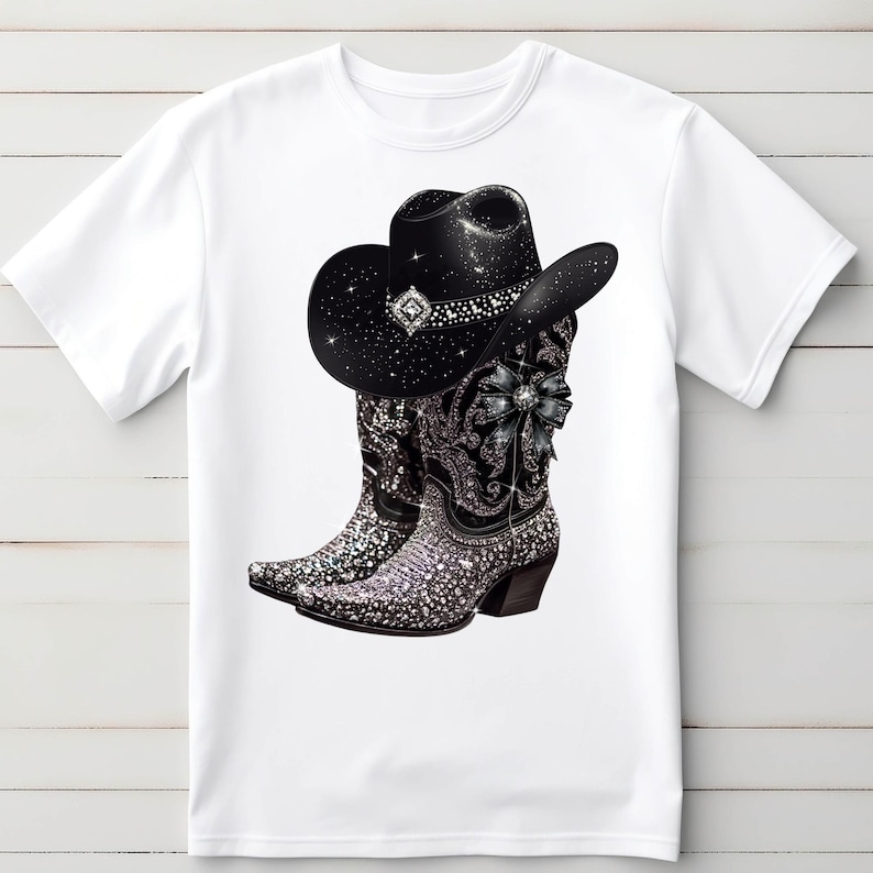 May include: White t-shirt with a black cowboy hat and boots with rhinestones. The hat and boots are decorated with a black bow.