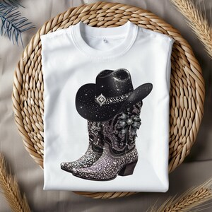 May include: White t-shirt with a black cowboy hat and boots covered in rhinestones.