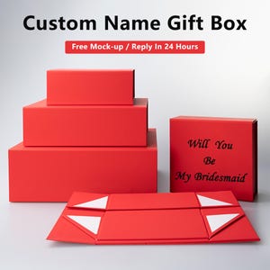 May include: Red gift boxes with a fold-over lid. The top box has the text "Will You Be My Bridesmaid" printed on it.