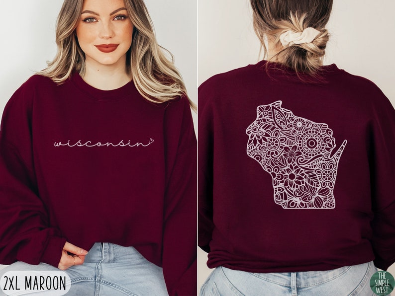 May include: A maroon sweatshirt with the word "Wisconsin" in white script on the front and a white outline of the state of Wisconsin filled with a floral pattern on the back.