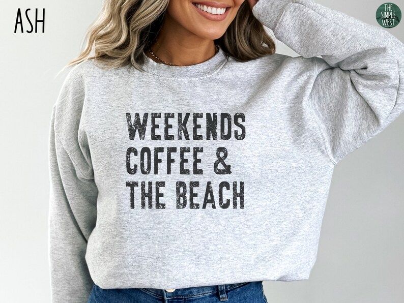 May include: A gray sweatshirt with the text "Weekends Coffee & The Beach" printed on the front.