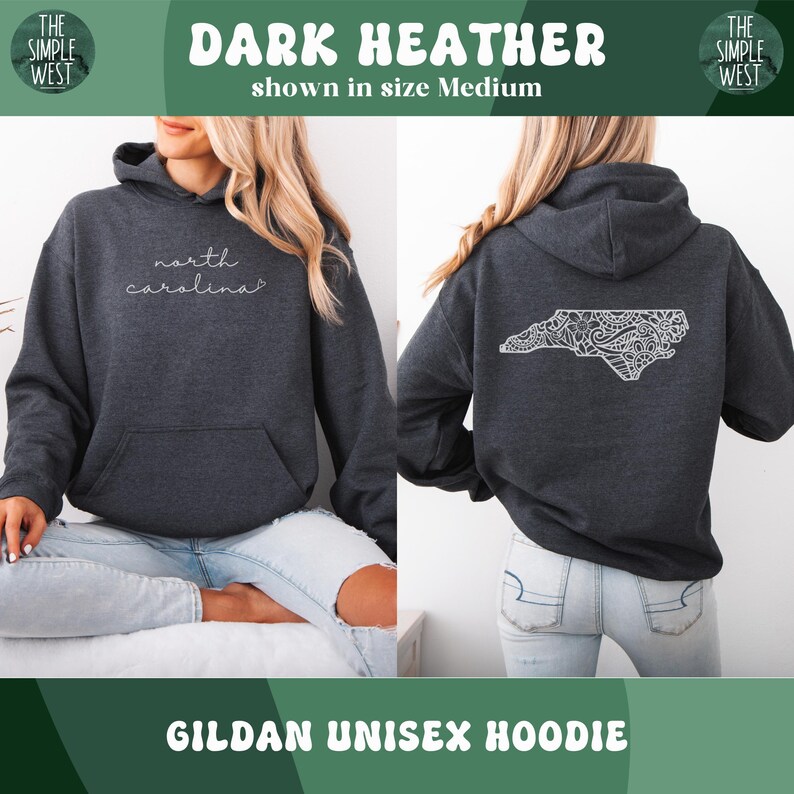 May include: Dark heather gray Gildan unisex hoodie. The front features the text "north carolina" in a cursive font. The back displays a white, detailed outline of North Carolina. The Simple West logo is visible.