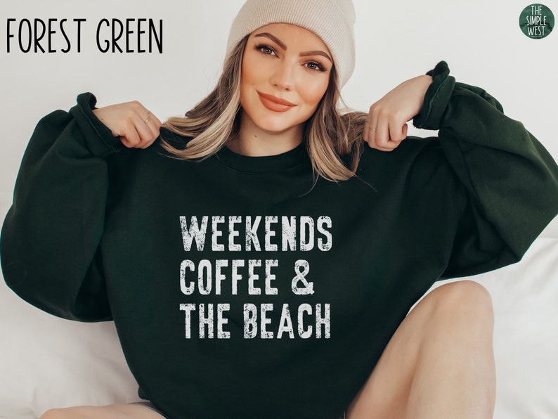 May include: Forest green sweatshirt with the text "Weekends Coffee & The Beach" in white distressed lettering.