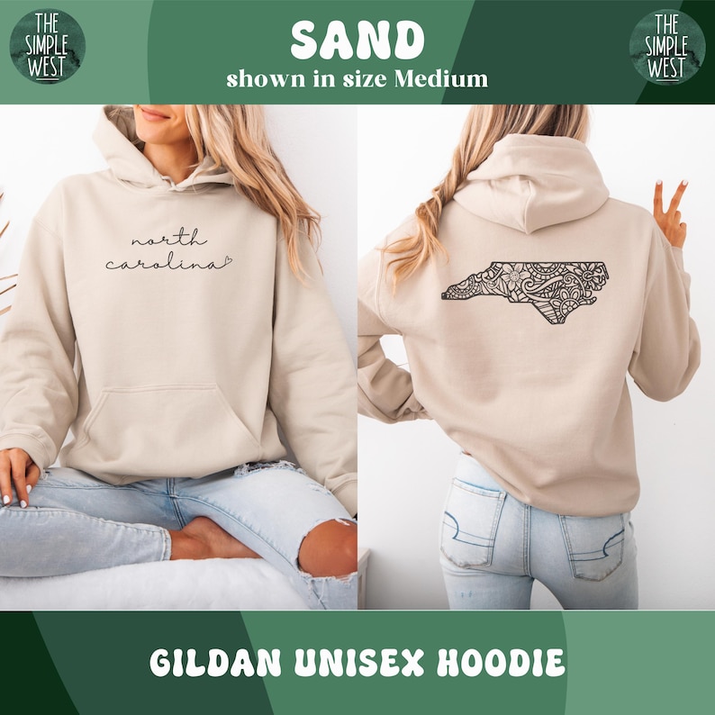 May include: Sand-colored Gildan unisex hoodie. The front features the script "north carolina". The back displays a detailed black outline of North Carolina with an intricate design. The hoodie is shown in size Medium.