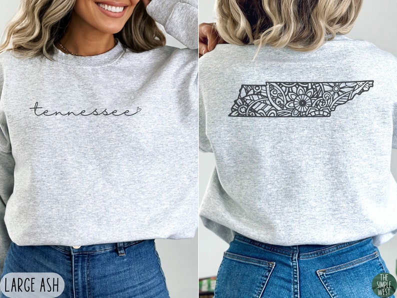 May include: A gray sweatshirt with the word "tennessee" in cursive on the front and a black and white mandala design of the state of Tennessee on the back.