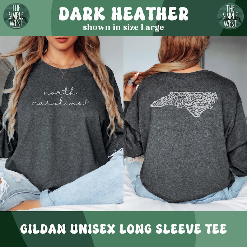May include: Dark heather long-sleeve tee with "north carolina" in white script on the front. The back features a white, detailed outline of North Carolina. The shirt is a Gildan unisex long sleeve tee.